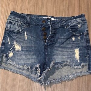 Light-wash jean shorts with rips